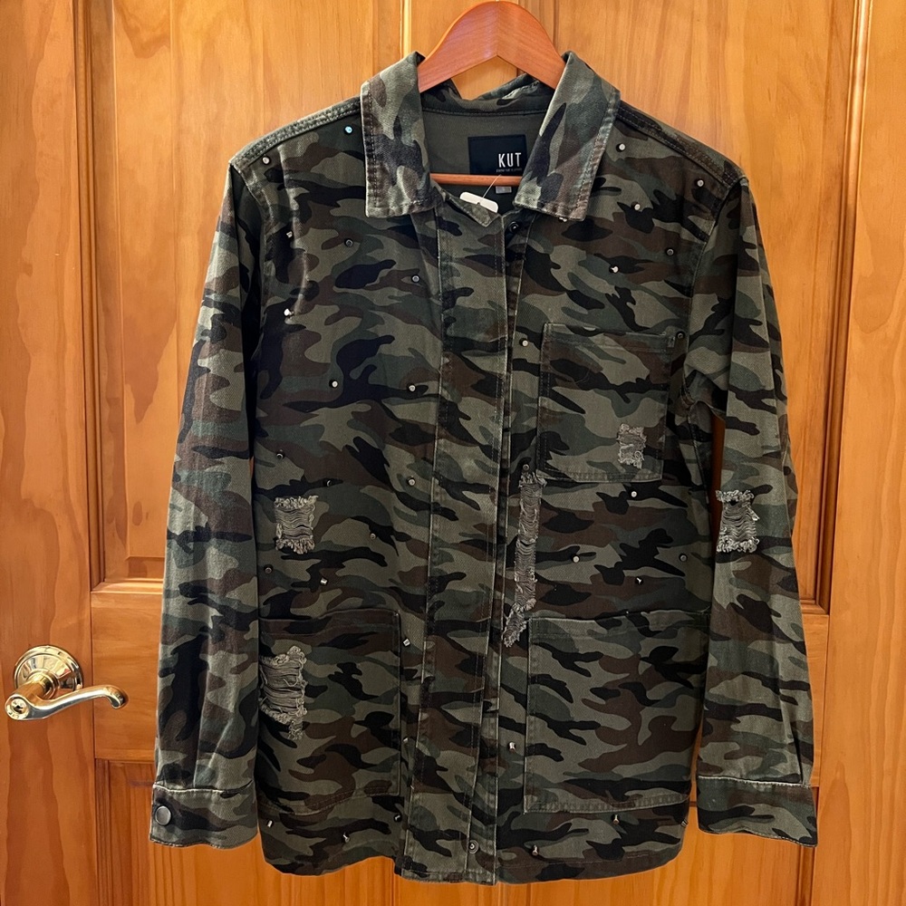 Jut from the Kloth, silver studded camp jacket.